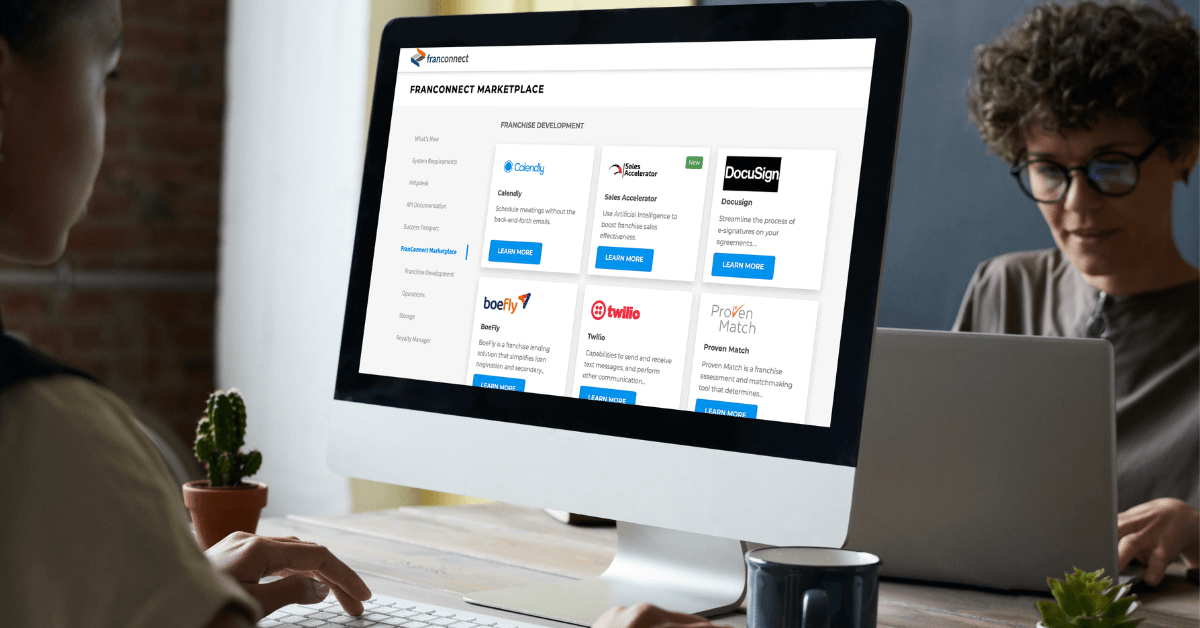 Someone browsing FranConnect Marketplace on a Mac computer
