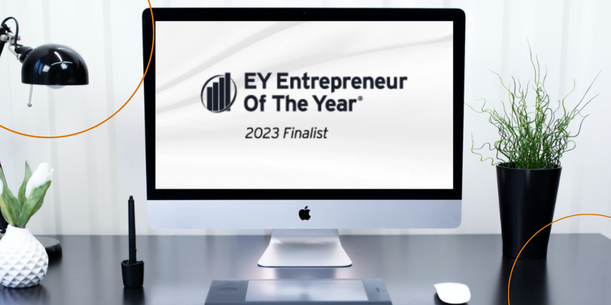 A desktop features the Entrepreneur of the Year logo