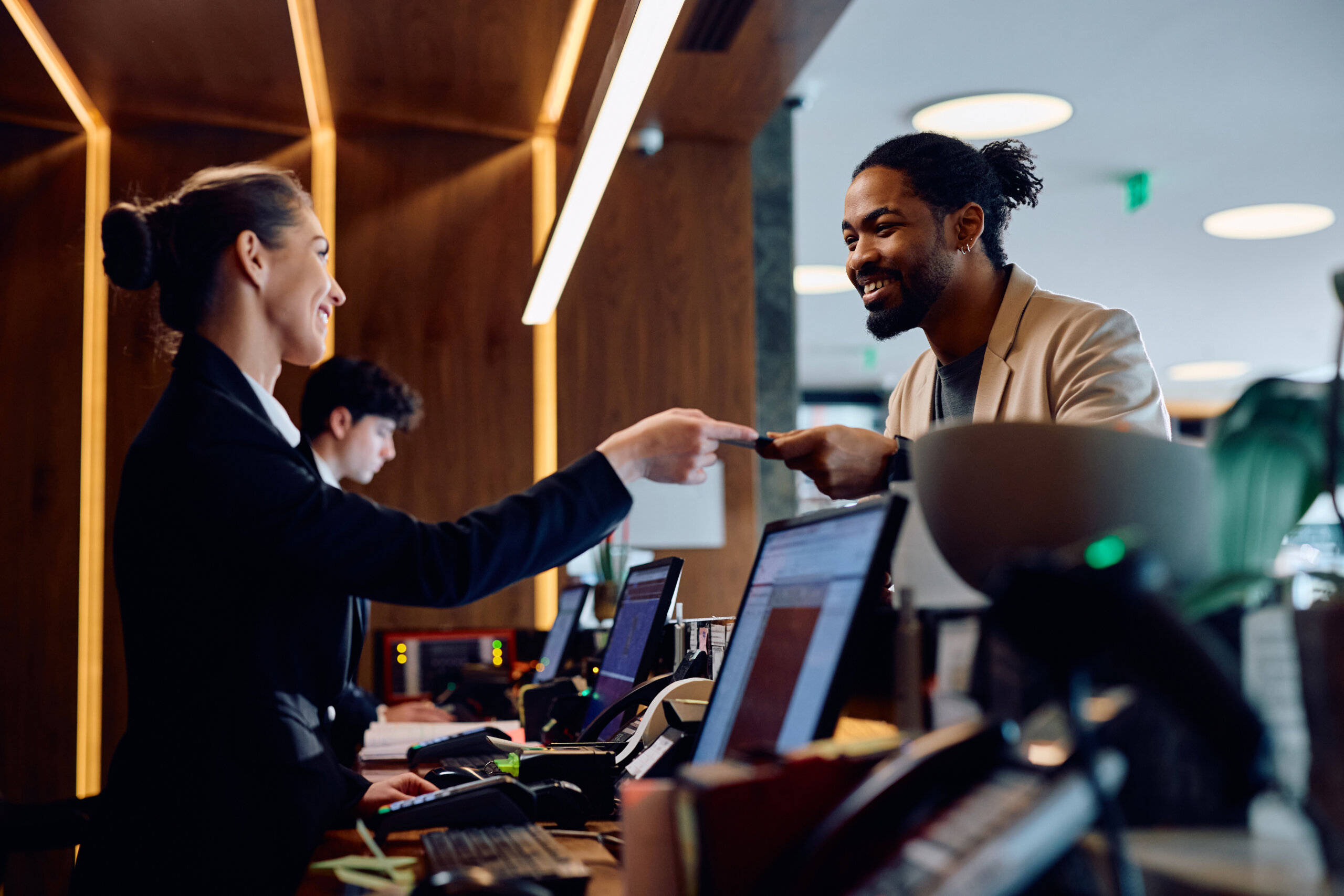 Man checking into hotel and receiving room key